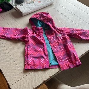 Like new, lightly used, vibrant polka dot North Face girls raincoat.